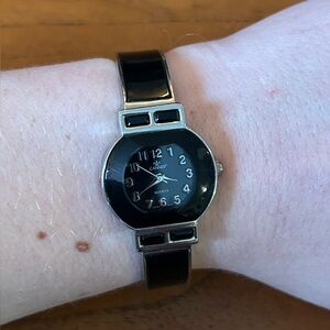 Ladie’s Cannes Silver Toned and Black Enamel Hinged Bracelet Watch